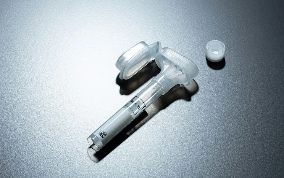 A saliva collection tube used for a genetic test
